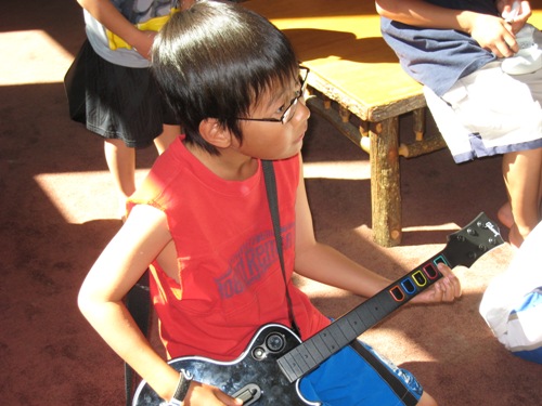 Josiah and Guitar Hero.JPG