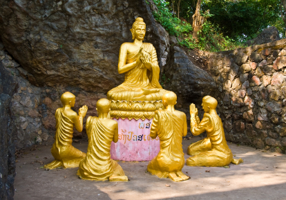 Buddha and monks statue meditaing, Laos.